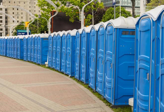 a row of portable restrooms set up for a special event, providing guests with a comfortable and sanitary option in Amityville